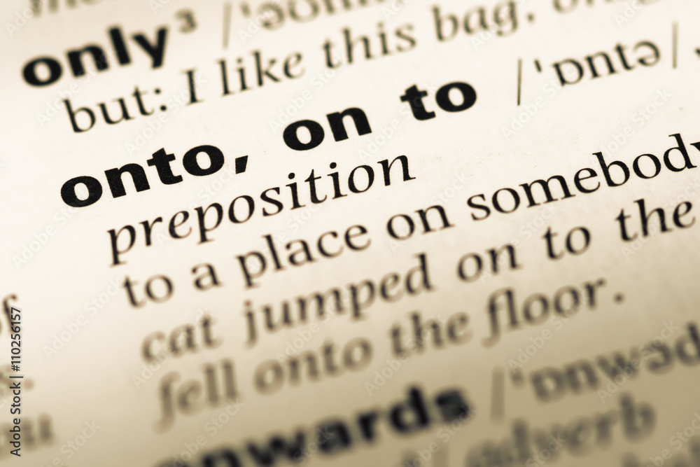 Close up of old English dictionary page with word onto on to Close up of old English dictionary page with word onto on to