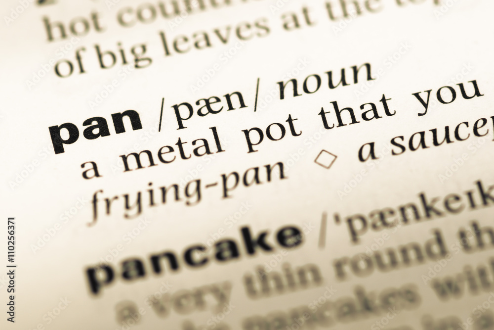 Close up of old English dictionary page with word pan Close up of old English dictionary page with word pan