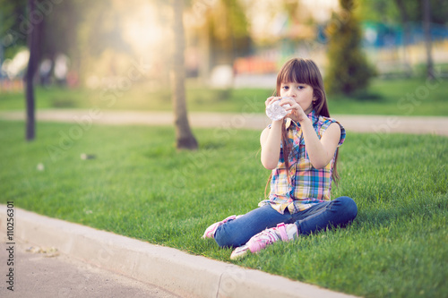 girl on grass in the park.