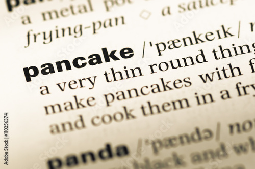 Close up of old English dictionary page with word pancake