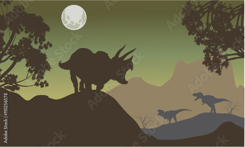 Silhouette of triceratops and baby T-Rex