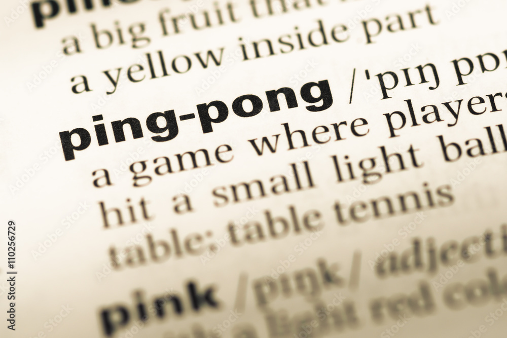 Close up of old English dictionary page with word ping pong Close up of old English dictionary page with word ping pong