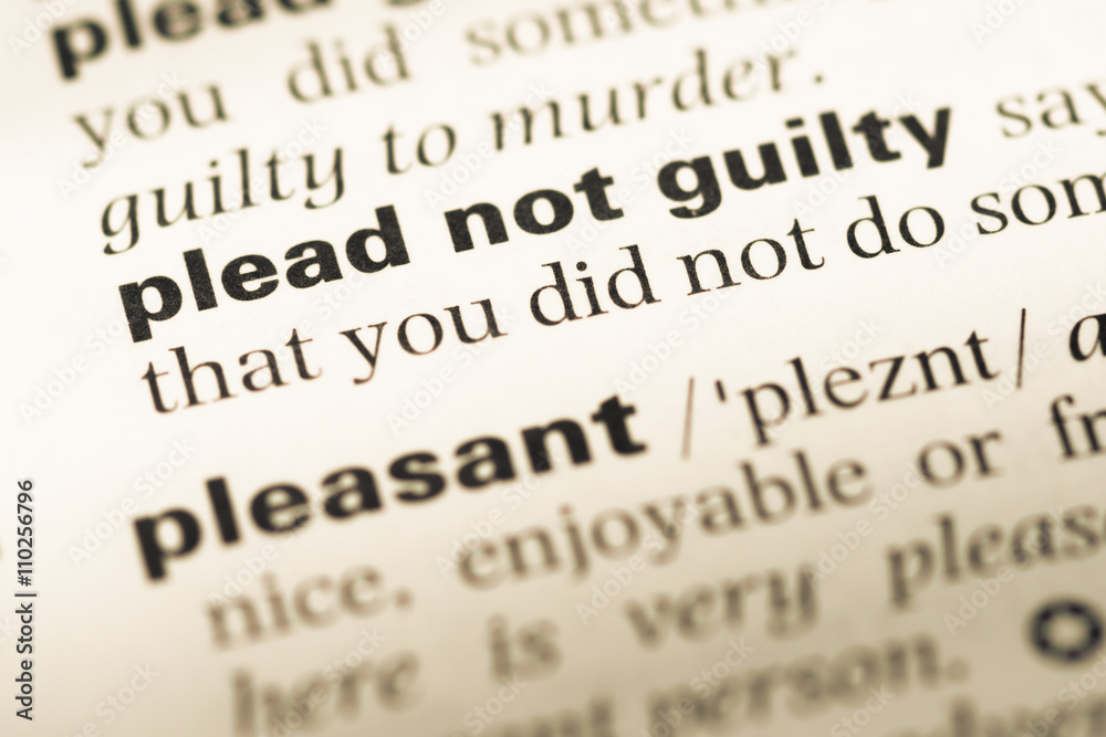 Close up of old English dictionary page with word plead not guil Close up of old English dictionary page with word plead not guil