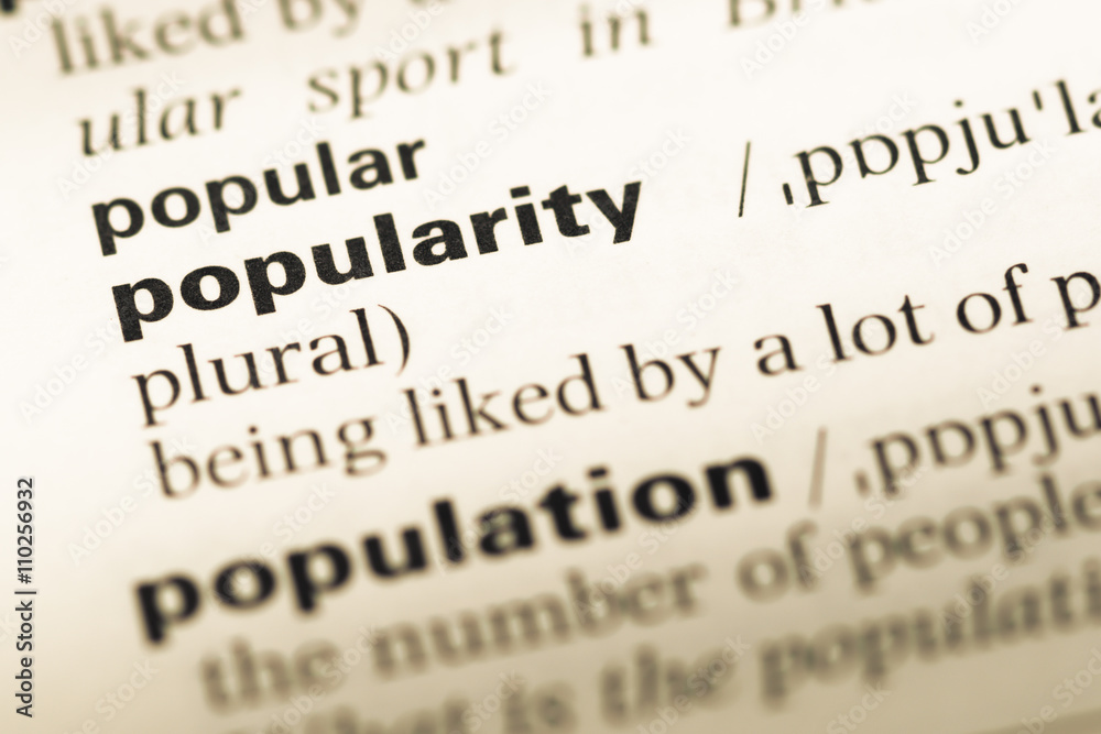Close up of old English dictionary page with word popularity Close up of old English dictionary page with word popularity