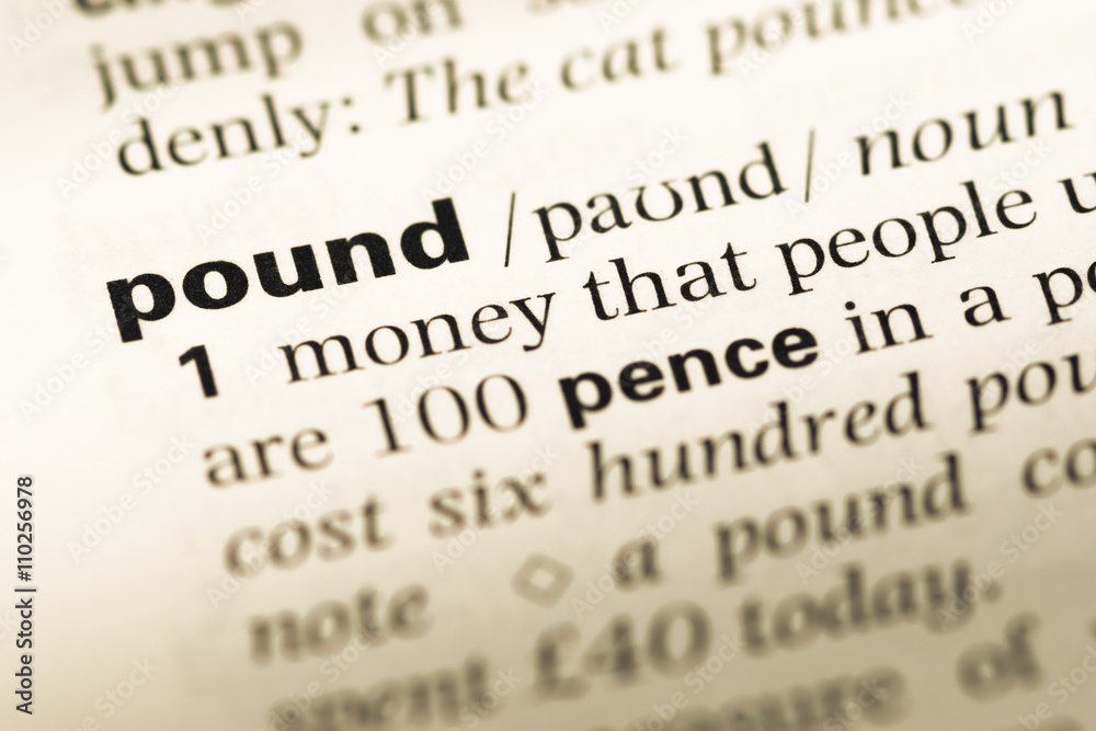Close up of old English dictionary page with word pound Close up of old English dictionary page with word pound