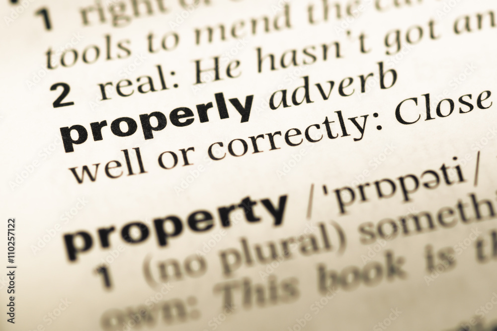 Close up of old English dictionary page with word property Close up of old English dictionary page with word property