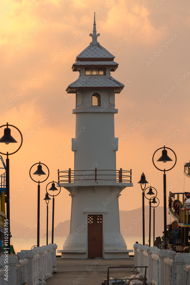 Sunrise with light house and Pier on Ko Chang Island, Thailand