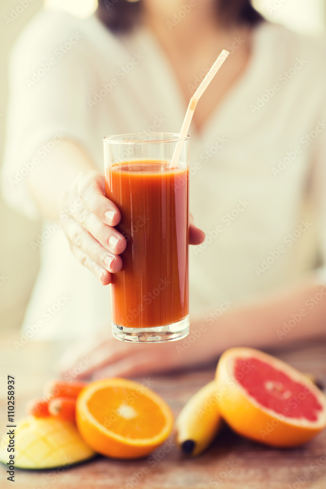 close up of woman hands with juice and fruits close up of woman hands with juice and fruits