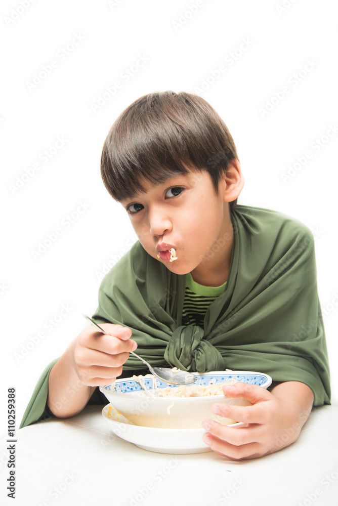 Little boy eating instant noodle on white background Little boy eating instant noodle on white background