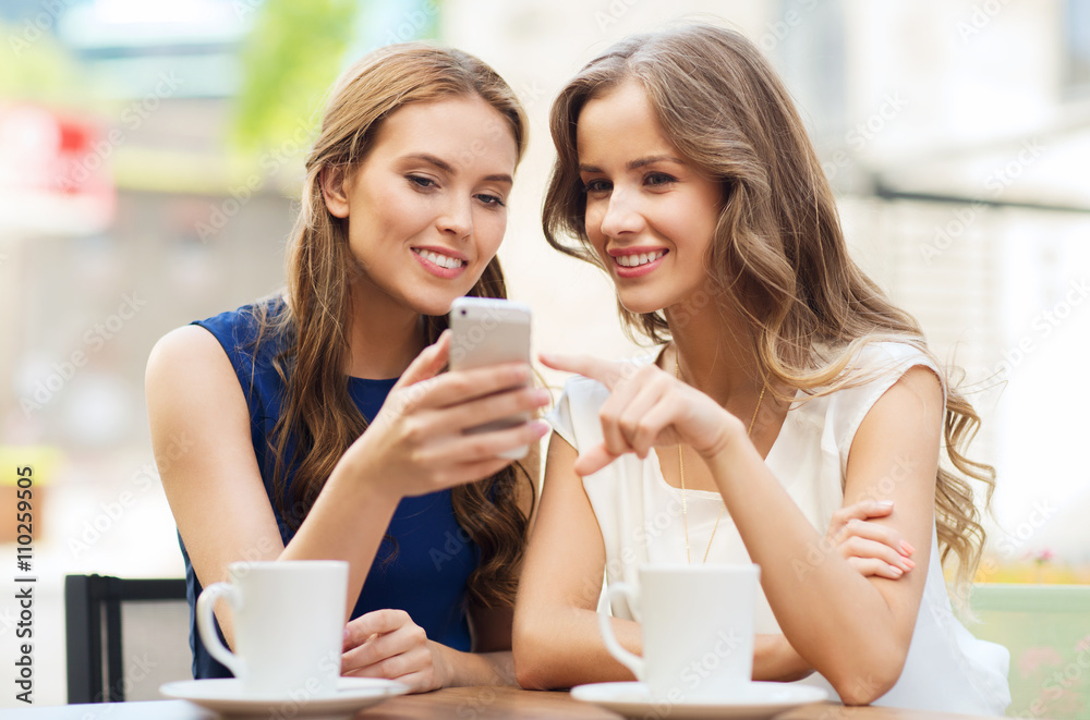 young women with smartphone and coffee at cafe young women with smartphone and coffee at cafe