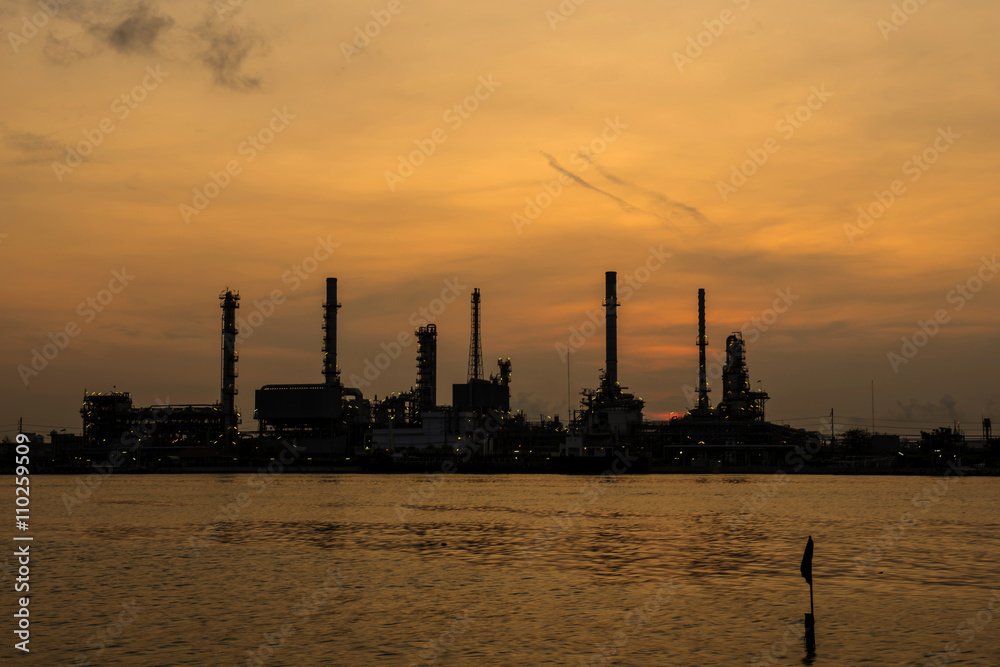 Silhouette of oil refinery factory in morning.