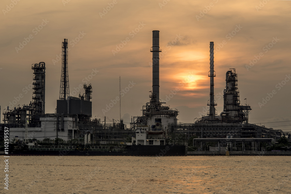 Silhouette of oil refinery factory in morning.