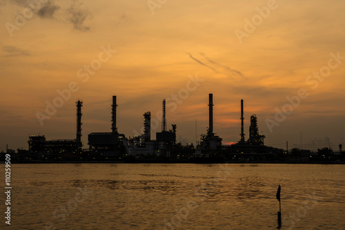 Silhouette of oil refinery factory in morning.