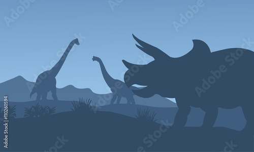 Fototapeta Naklejka Na Ścianę i Meble -  Silhouette triceratops and Brachiosaurus