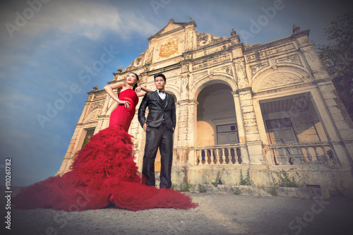 Man and Beautyful woman wearing fashionable red dress