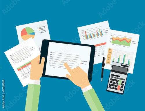 business hand touch on analytic graph in device with report paper concept .business planning and business investment concept.
