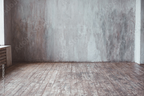 Vintage Background. Cement wall and wooden floor.