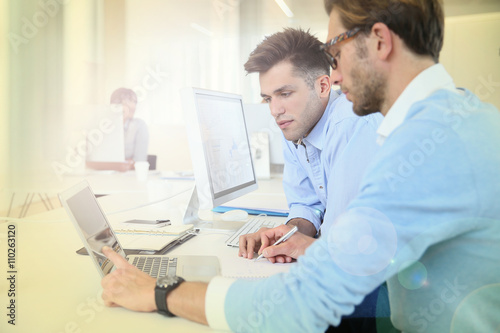 Businessmen in work meeting with laptop computer