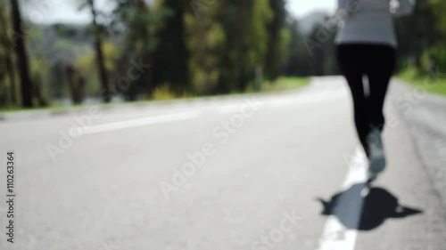 Wallpaper Mural Woman setting up the fitness smart watch for running.  Torontodigital.ca