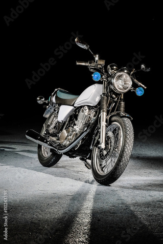 Vintage sport bike on a black background