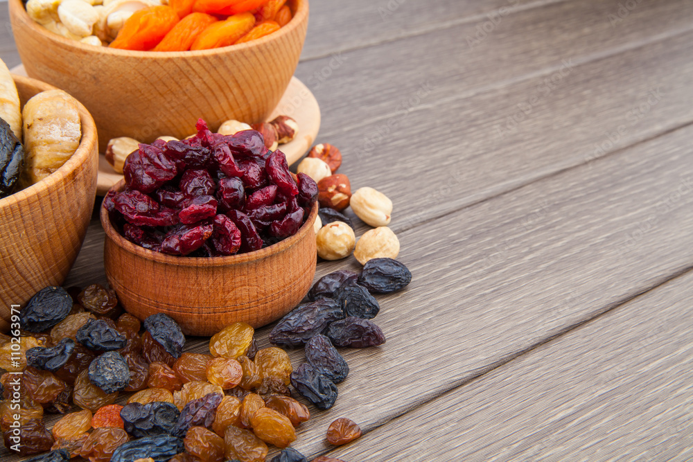 Fototapeta premium Dried fruits in wooden bowl