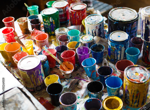 multicolored cans with paint, arts background