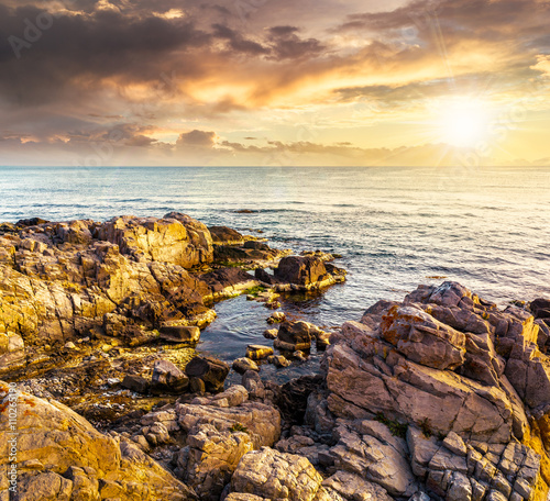 sea landscape on the rocky coast at sunset © Pellinni