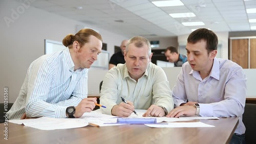 Engineers in the office discussing a new project