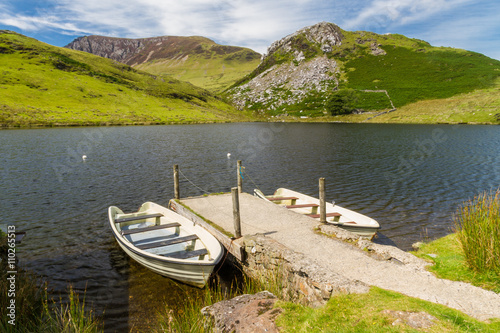 Two rowing boats by jetty  Snowdonia.