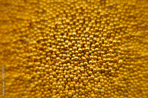 Abstract sparkling gold background with gold balls. Background. Texture.