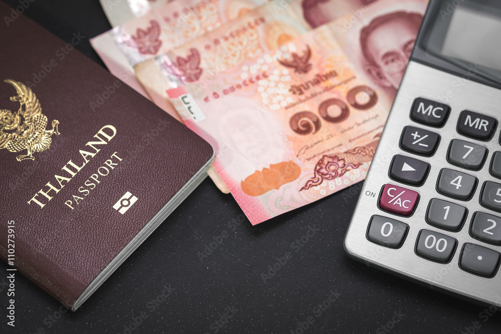 Passport, notes and calculator on black table, concept of business man and travel. Passport, notes and calculator on black table, concept of business man and travel.
