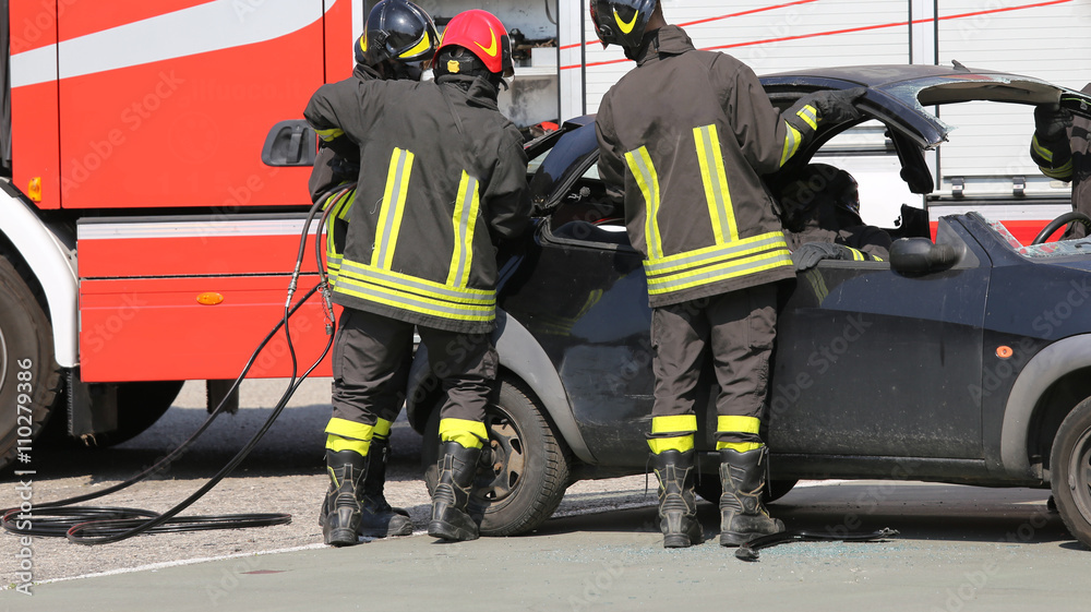 firefighters in action during the road accident