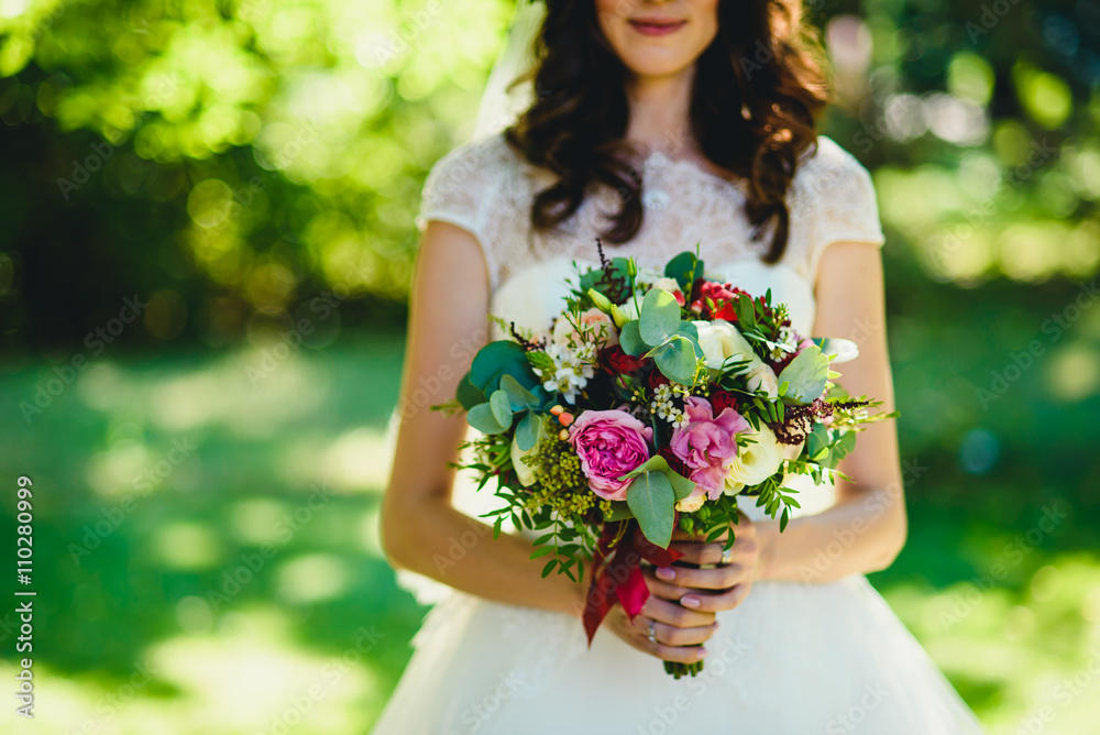 beautiful bride holding a bouquet of roses beautiful bride holding a bouquet of roses