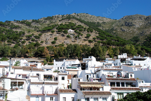 Buildings at the rear of the Plaza Virgen de la Peña with the Ermita del Calvario on hillside to rear, Mijas. © arenaphotouk