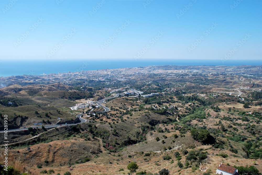 Elevated view of Fuengirola along the coastline and surrounding countryside, Mijas.