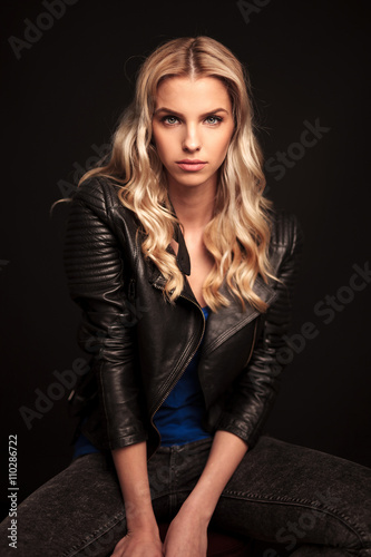 portrait of a fashion biker woman in leather jacket