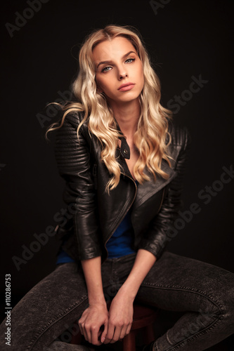 fashion blonde woman in leather jacket posing