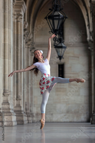 Graceful ballerina dancing the pose "attitude en avant"