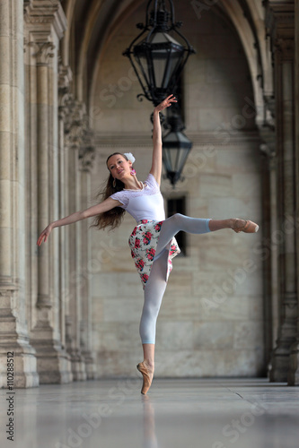 Graceful ballerina dancing the pose "attitude en avant"