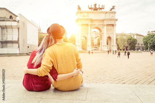 Romantic couple enjoying the sunset watching the monuments in the city center