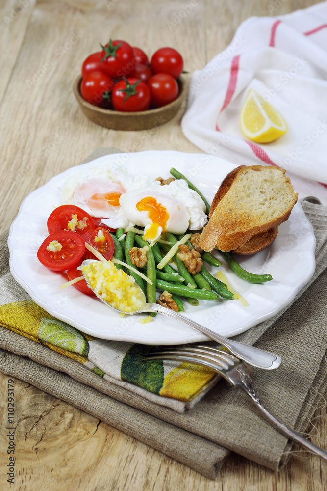 Nice breakfast with vegetables and poached eggs