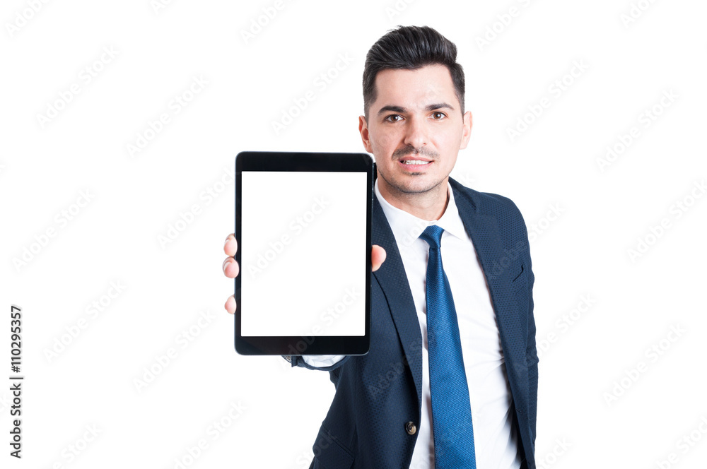 Young attractive salesman holding digital tablet with blank scre Young attractive salesman holding digital tablet with blank scre