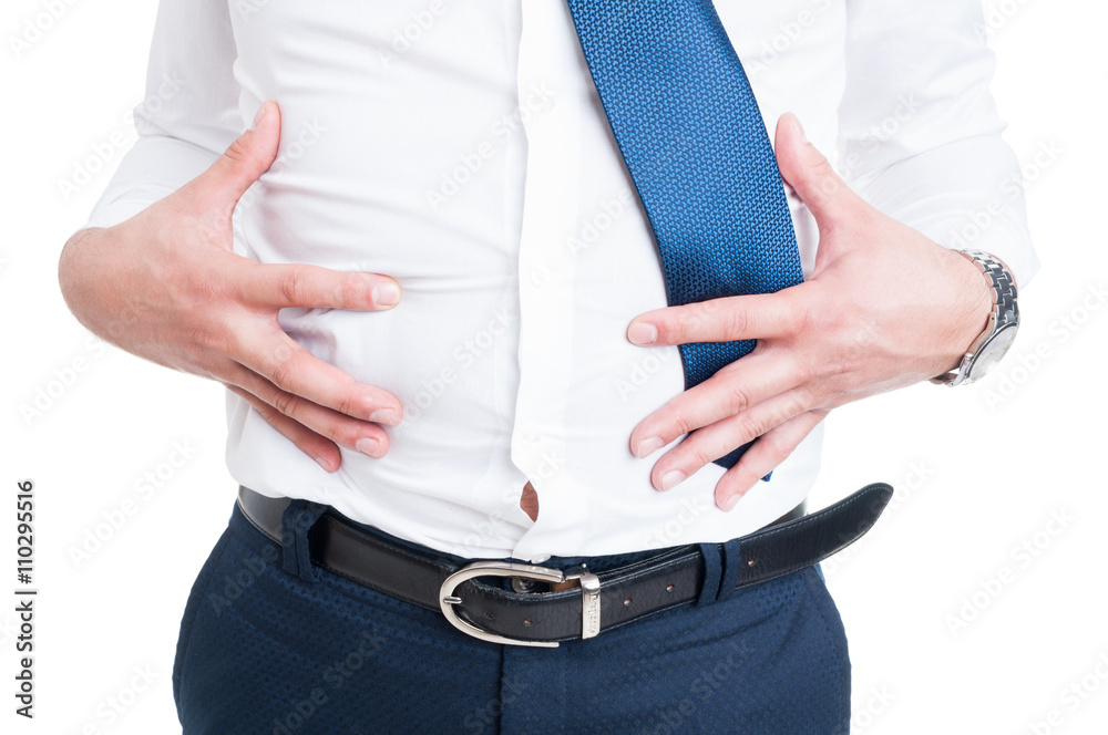 © Catalin Pop - Businessman in closeup holds his stomach because of bloating © Catalin Pop - Businessman in closeup holds his stomach because of bloating
