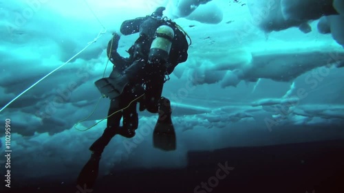 Wallpaper Mural Unique extreme underwater shooting scuba dive beneath ice at geographic  North Pole in cold waters. Fantastic views of the lump of ice in water. ICE CAMP BARNEO, NORTH POLE, ARCTIC - APRIL 10, 2015 Torontodigital.ca