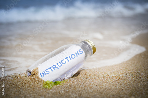 Instructions concept of message in a bottle photo