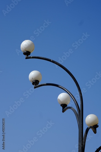 vintage street lamp over blue sky. Selective focus