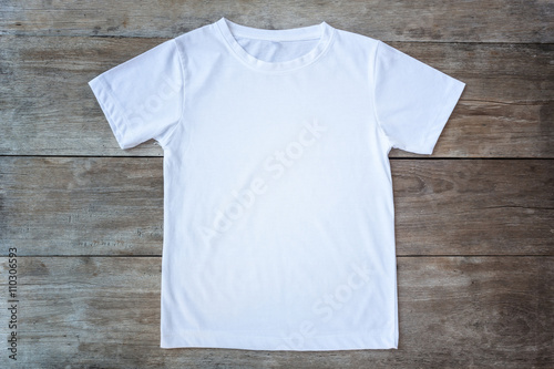 Top view of color T-Shirt on grey wood plank