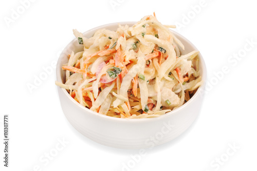 Side view of  bowl filled with coleslaw isolated on  white background.