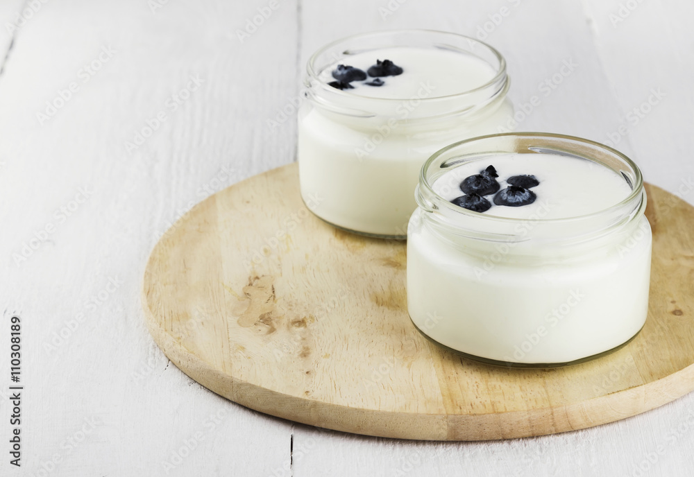 Yogurt with blueberry on a white background Yogurt with blueberry on a white background