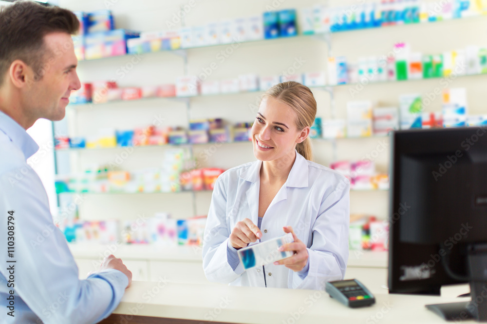 Pharmacist and client at pharmacy
